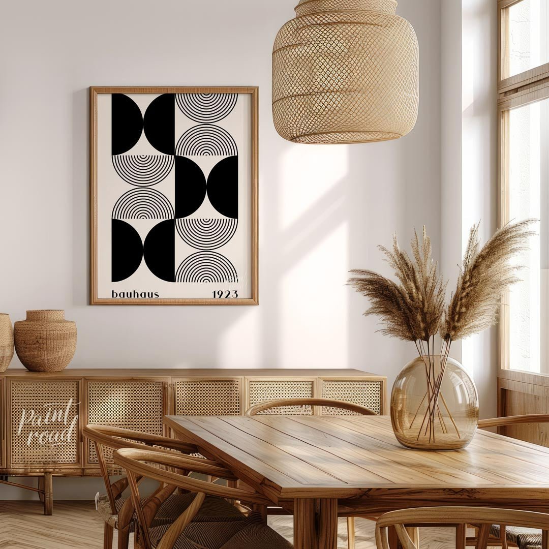 This striking art print is a homage to the iconic Bauhaus movement, featuring a sophisticated black… for dining room