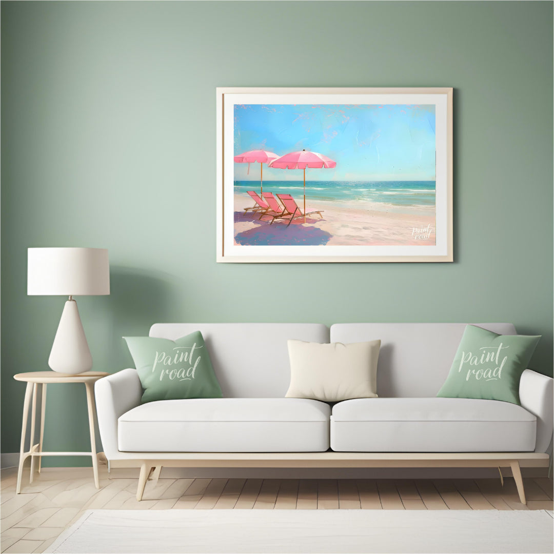 This artwork captures a tranquil beach scene with two pink parasols and matching lounge chairs set … for living room