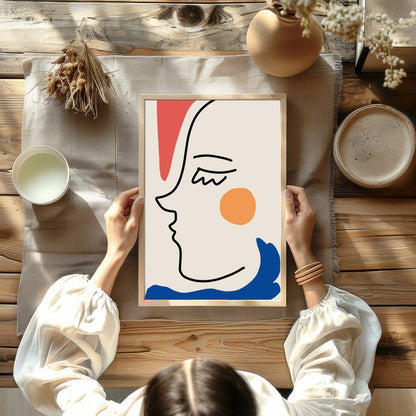 This captivating minimalist artwork features a continuous line drawing of a face, accented with for Kitchen