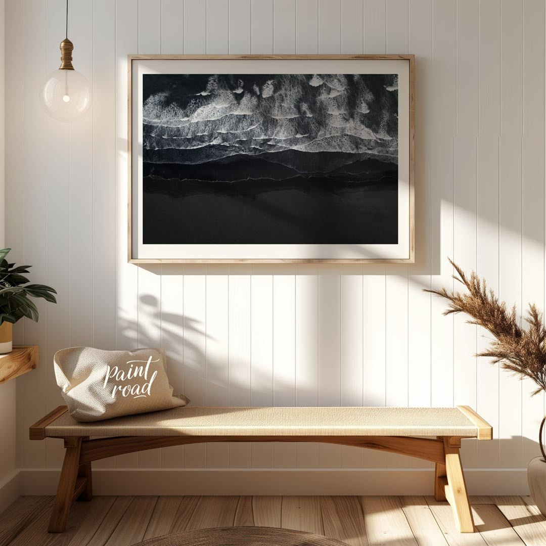 This stunning aerial photograph captures the dramatic beauty of a black sand beach, likely in Icela… for entryway