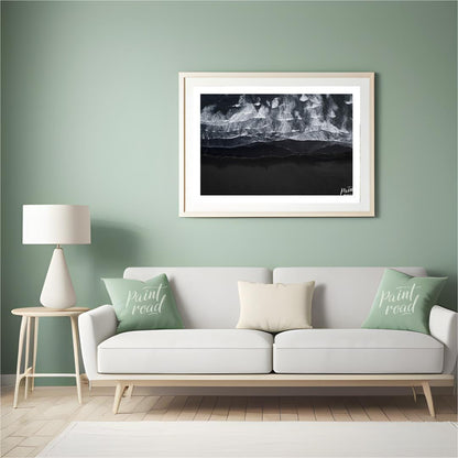 This stunning aerial photograph captures the dramatic beauty of a black sand beach, likely in Icela… for living room