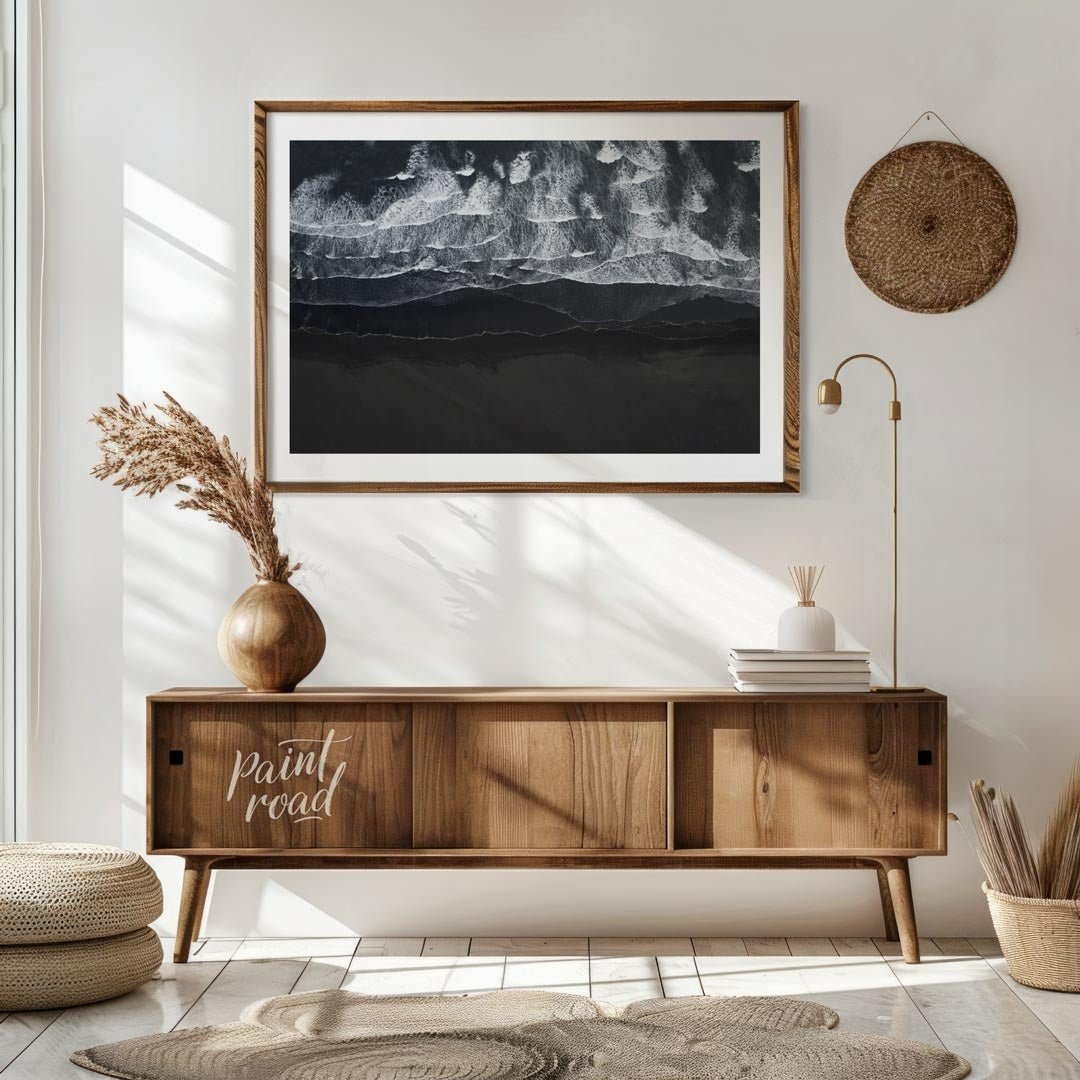 This stunning aerial photograph captures the dramatic beauty of a black sand beach, likely in Icela… for living room