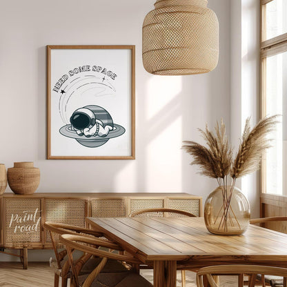 This whimsical design features a cartoon astronaut lounging effortlessly on the rings of Saturn, ne… for dining room
