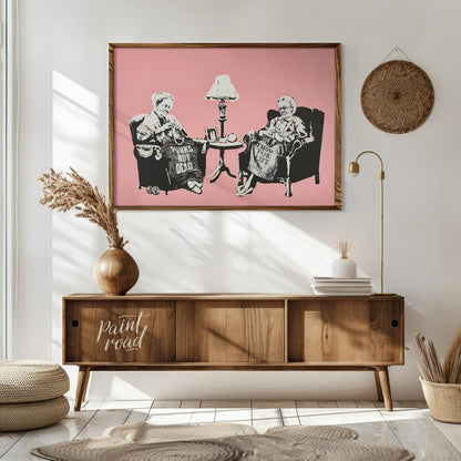 This iconic Banksy print, titled “Grannies,” features two elderly women seated in armchairs, dilige… for living room
