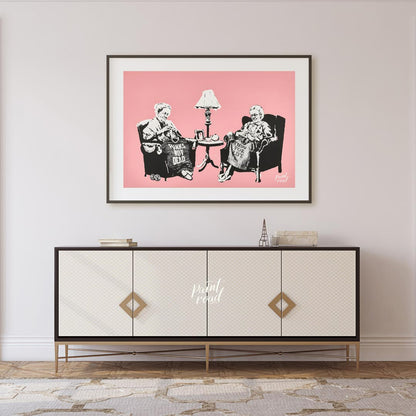 This iconic Banksy print, titled “Grannies,” features two elderly women seated in armchairs, dilige… for living room