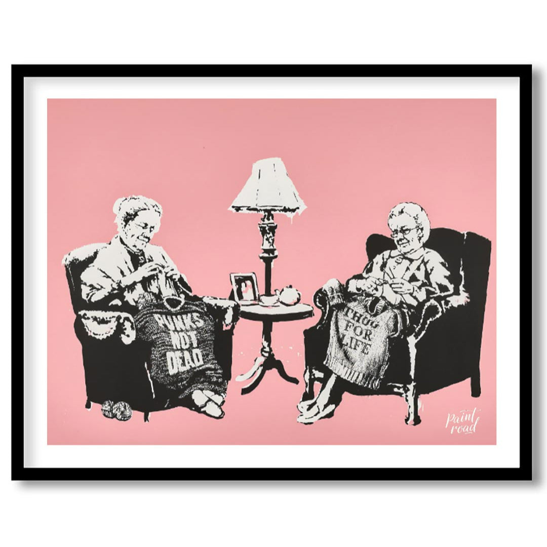 This iconic Banksy print, titled “Grannies,” features two elderly women seated in armchairs, dilige… for room