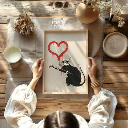 This striking art print features Banksy’s “Love Rat” stencil, depicting a black rat holding a paint… for other