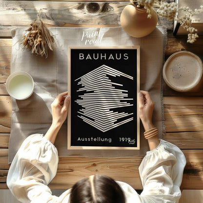 This striking image is a reproduction of a classic Bauhaus exhibition poster from 1919. Dominated b… for other