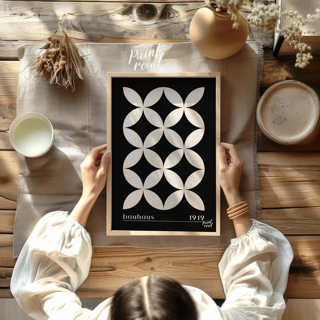 This high-contrast Bauhaus poster presents a captivating pattern of white petal-like shapes forming… for dining room