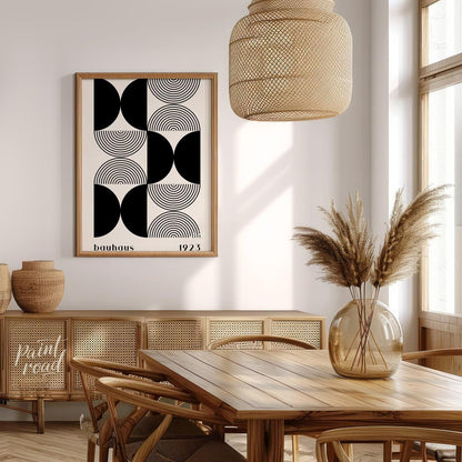 This striking art print is a homage to the iconic Bauhaus movement, featuring a sophisticated black… for dining room