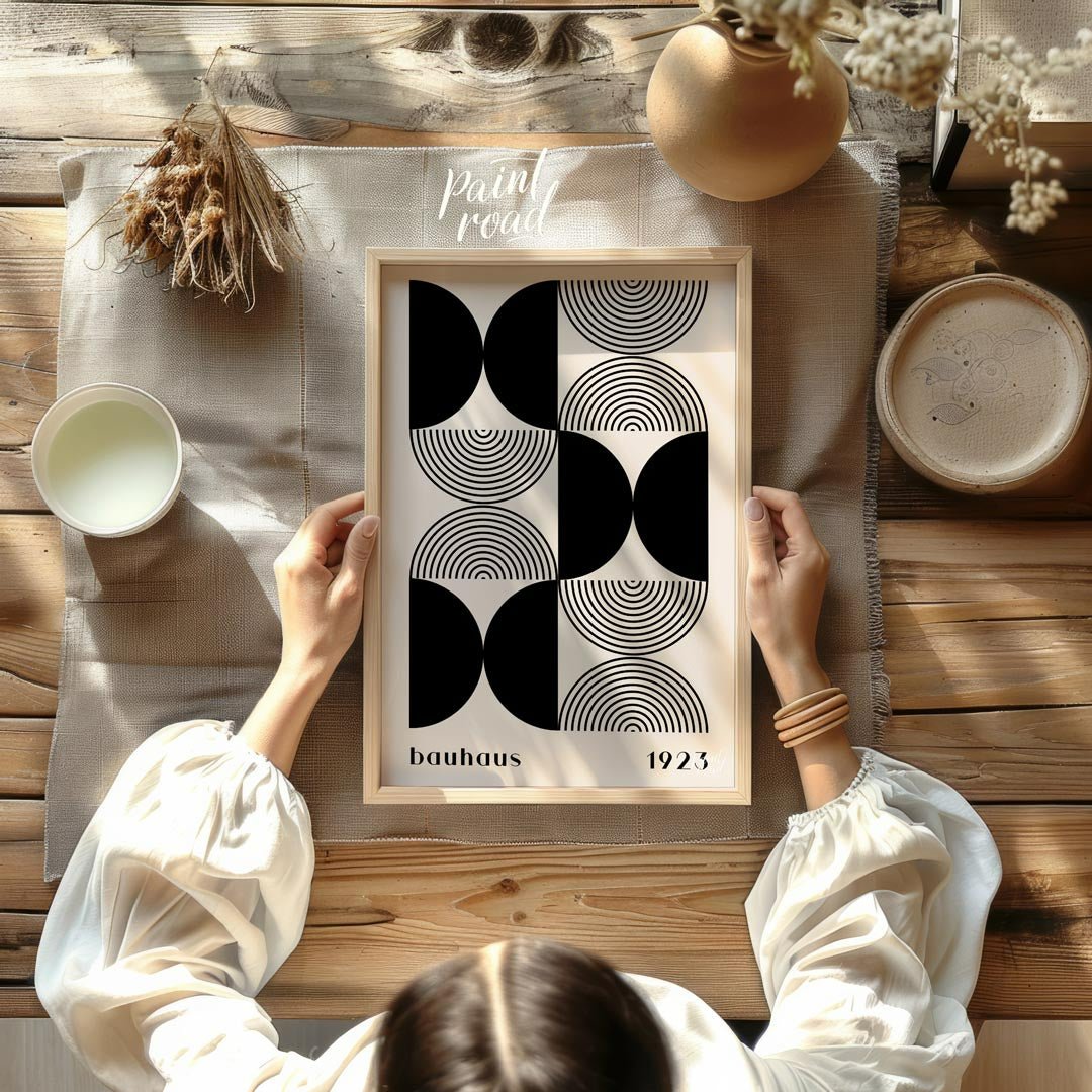 This striking art print is a homage to the iconic Bauhaus movement, featuring a sophisticated black… for other