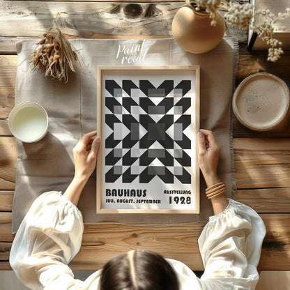 This captivating Bauhaus poster from 1928 features an intricate geometric pattern of squares and di… for other
