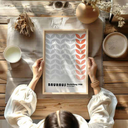 This Bauhaus-inspired poster features a rhythmic pattern of stylized leaf-like or chevron shapes, p… for dining room