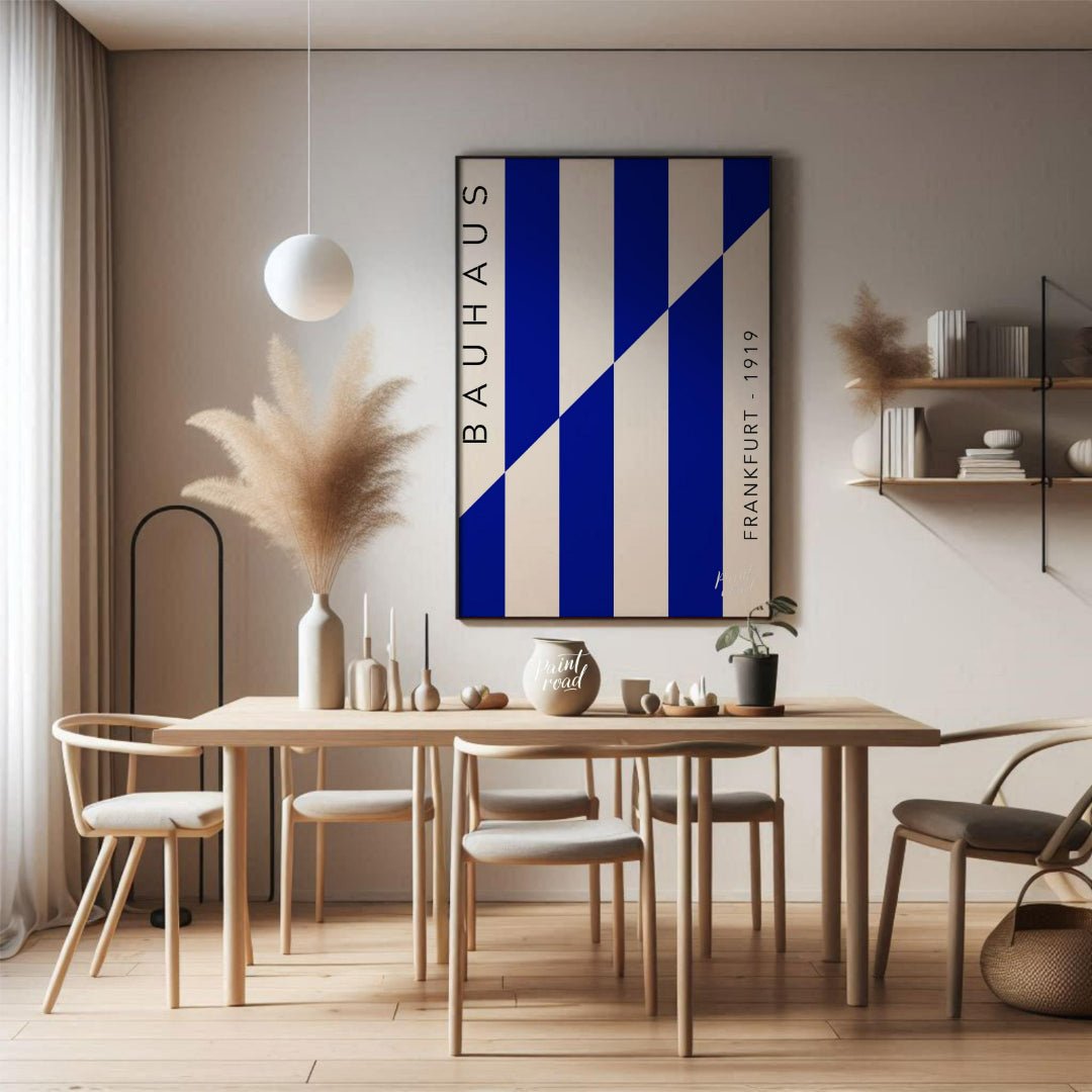 This striking Bauhaus-inspired print features a dynamic composition of bold blue and off-white vert… for dining room