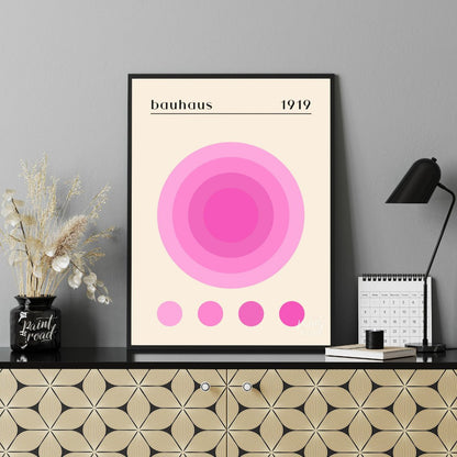 This Bauhaus-inspired print, "Bauhaus Pink Gradation Circle," showcases a central circular motif co… for office