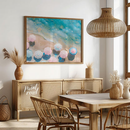 This aerial photograph captures a serene beach scene, showcasing a collection of pastel-colored par… for dining room