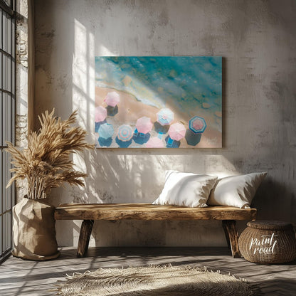 This aerial photograph captures a serene beach scene, showcasing a collection of pastel-colored par… for entryway