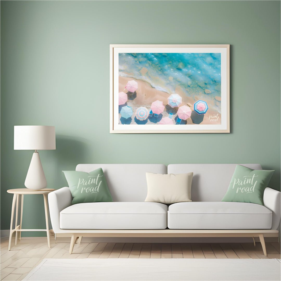 This aerial photograph captures a serene beach scene, showcasing a collection of pastel-colored par… for living room