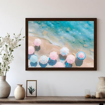This aerial photograph captures a serene beach scene, showcasing a collection of pastel-colored par… for living room