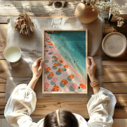 This digital illustration offers a bird's-eye view of a bustling beach scene. Colorful parasols, in… for other