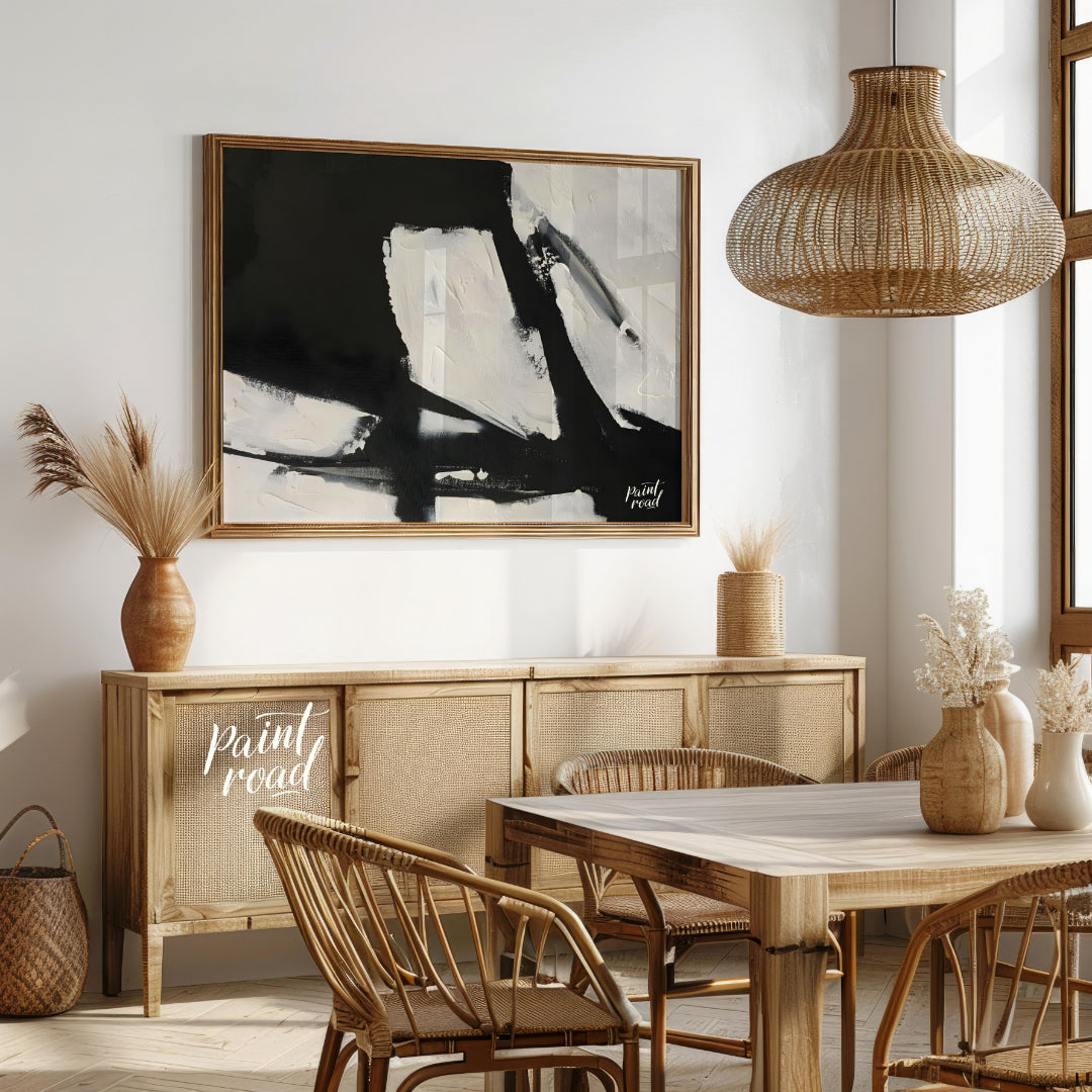 This abstract painting features a dynamic interplay of stark black and white shapes, creating a sen… for dining room