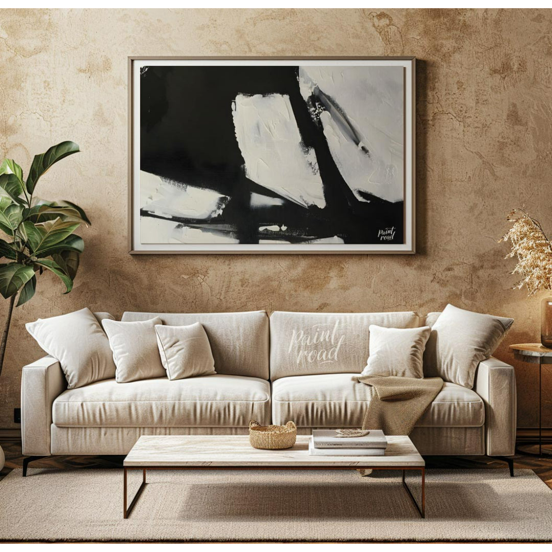 This abstract painting features a dynamic interplay of stark black and white shapes, creating a sen… for living room