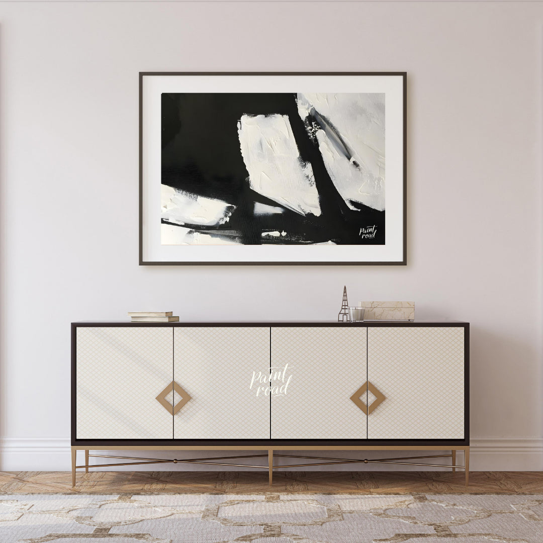 This abstract painting features a dynamic interplay of stark black and white shapes, creating a sen… for living room