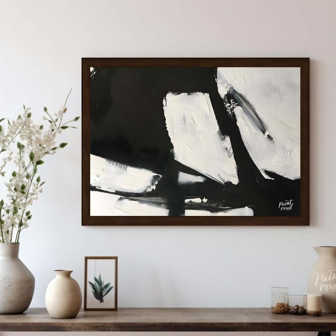 This abstract painting features a dynamic interplay of stark black and white shapes, creating a sen… for living room