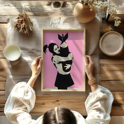 This poignant art print features Banksy’s famous “Bomb Hugger” stencil, depicting a small girl with… for other