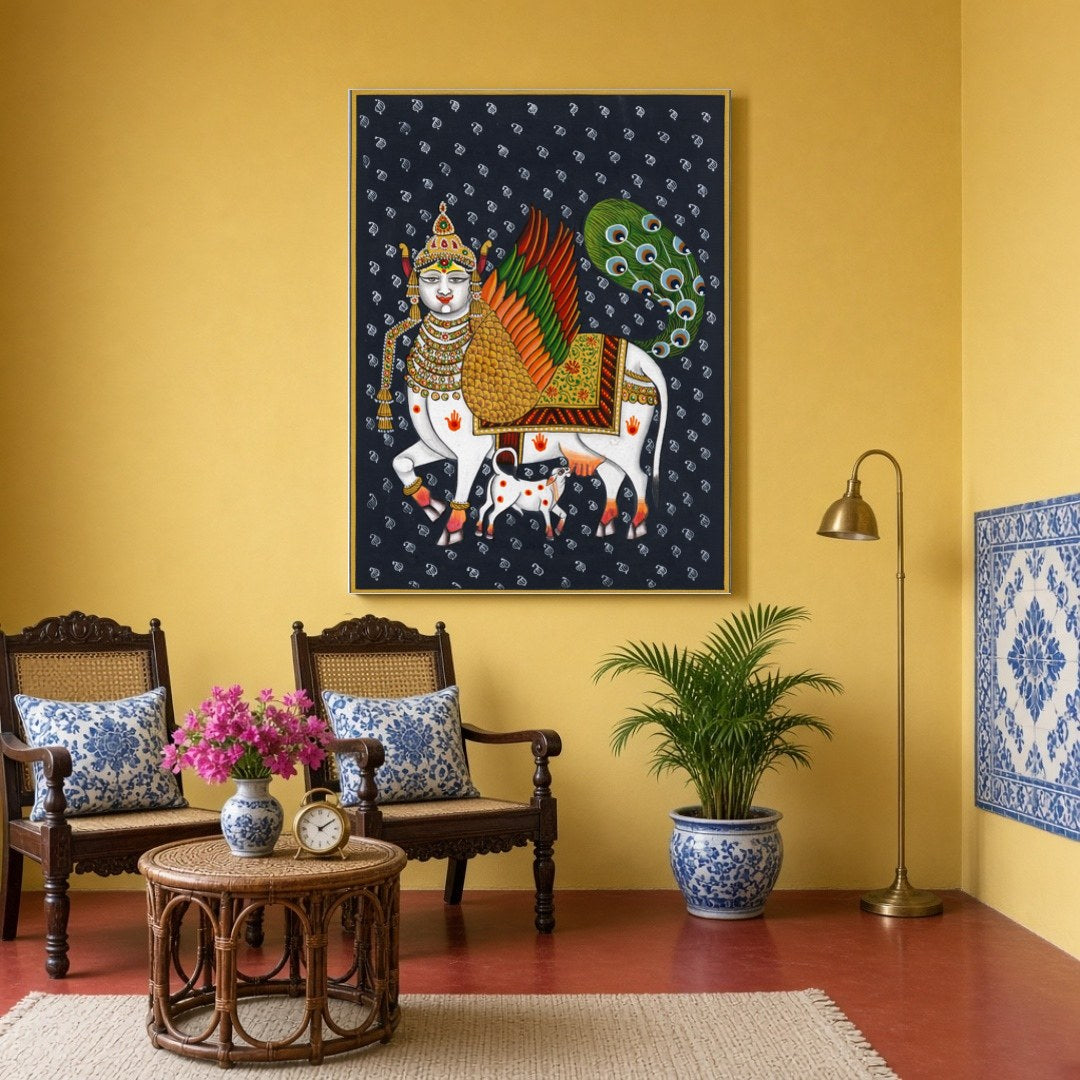 This captivating Pichwai artwork features the divine Kamdhenu adorned with vibrant wings and an for Sitting Area