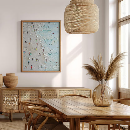 This painting captures a bustling beach scene with numerous figures enjoying the sand and surf. The… for dining room