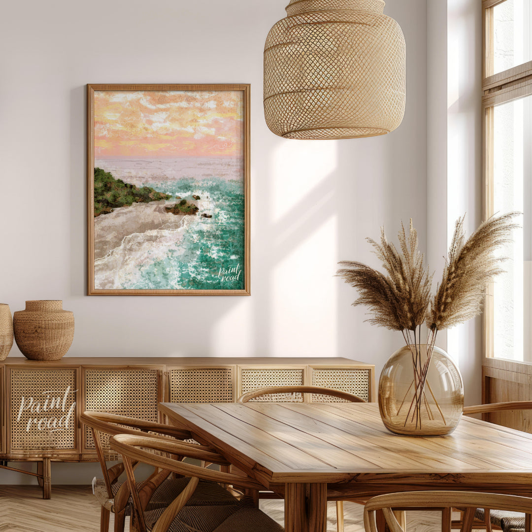 This artwork captures a serene coastal landscape at sunset. The sky is awash with soft hues of oran… for dining room