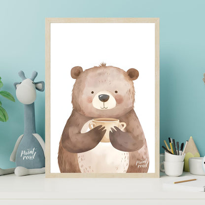 This heartwarming watercolor illustration portrays a plump, friendly bear holding a warm mug with b… for nursery