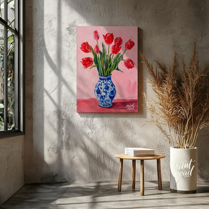 This artwork features a vibrant bouquet of red tulips arranged in a classic blue and white patterne… for living room