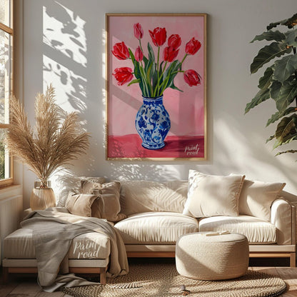 This artwork features a vibrant bouquet of red tulips arranged in a classic blue and white patterne… for living room