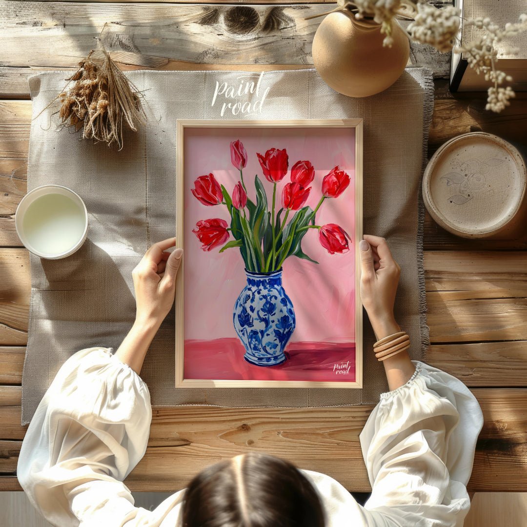 This artwork features a vibrant bouquet of red tulips arranged in a classic blue and white patterne… for other