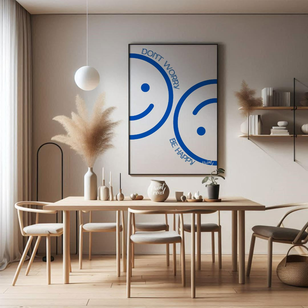 This cheerful and minimalist artwork features two large, abstract smiley faces rendered in a bright… for dining room