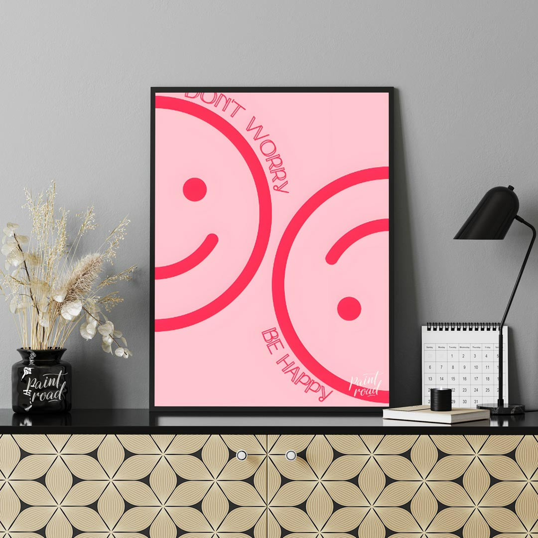 This cheerful and minimalist artwork features two large, abstract smiley faces rendered in a bright… for office