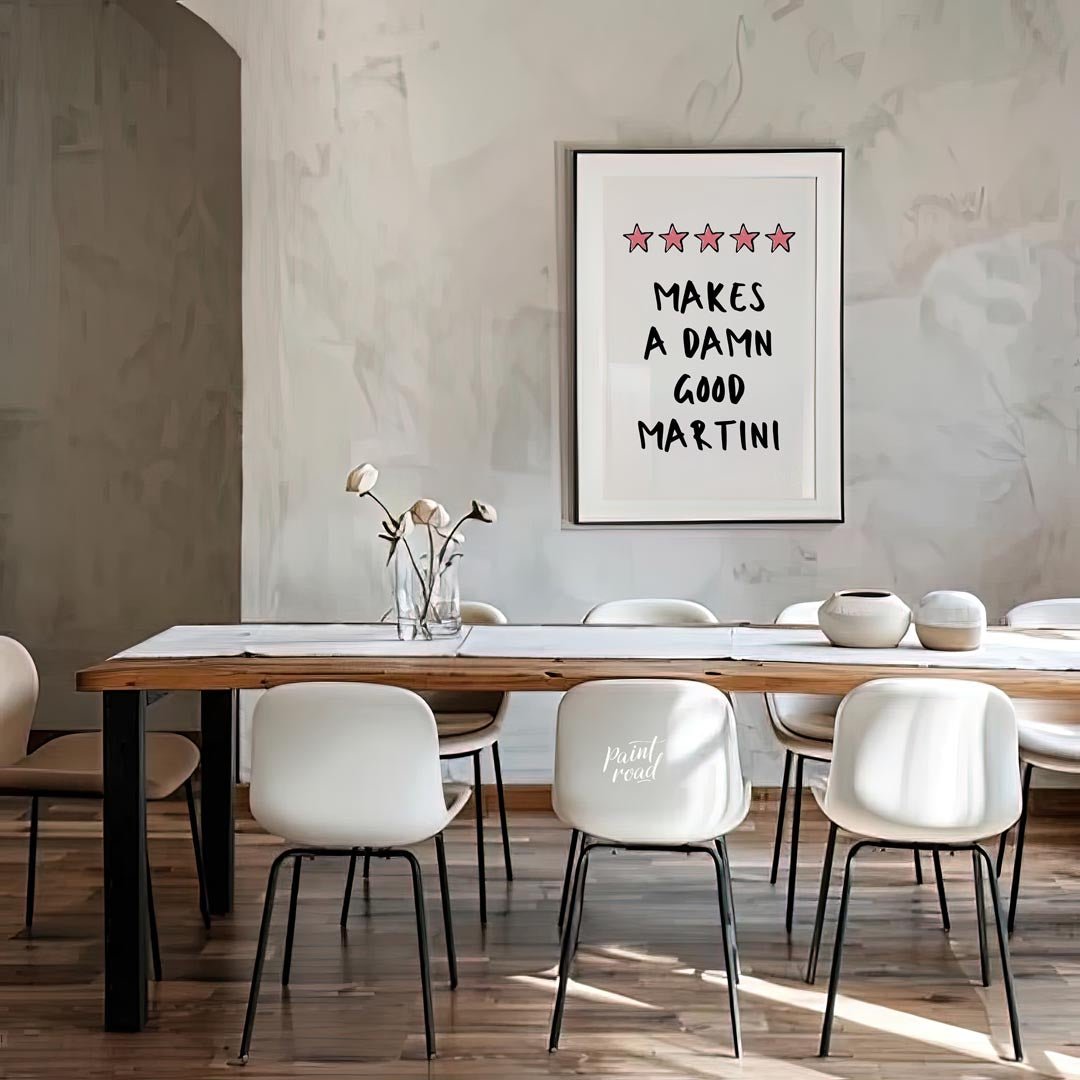 A fun and playful graphic design featuring the phrase "Makes a Damn Good Martini" written in a bold… for dining room