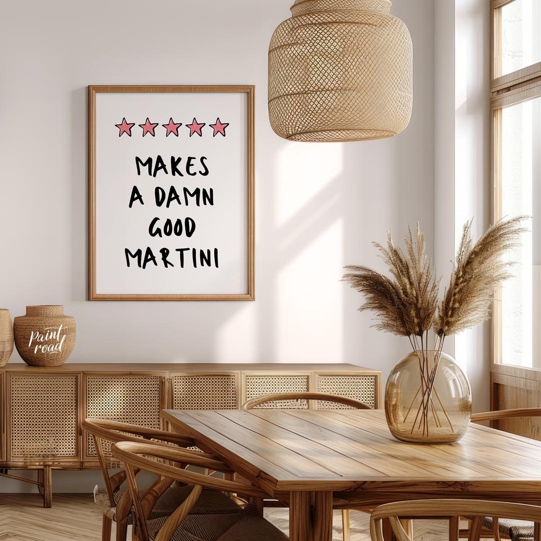 A fun and playful graphic design featuring the phrase "Makes a Damn Good Martini" written in a bold… for dining room