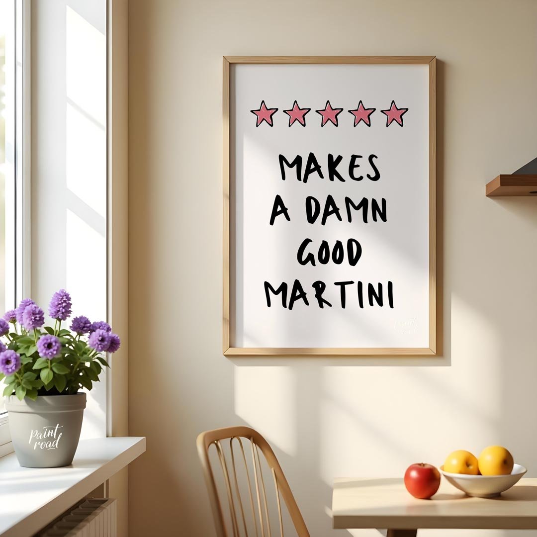 A fun and playful graphic design featuring the phrase "Makes a Damn Good Martini" written in a bold… for kitchen