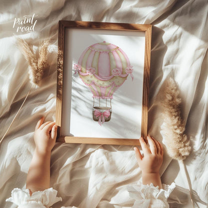 This elegant watercolor artwork features a beautifully decorated hot air balloon adorned with alter… for nursery