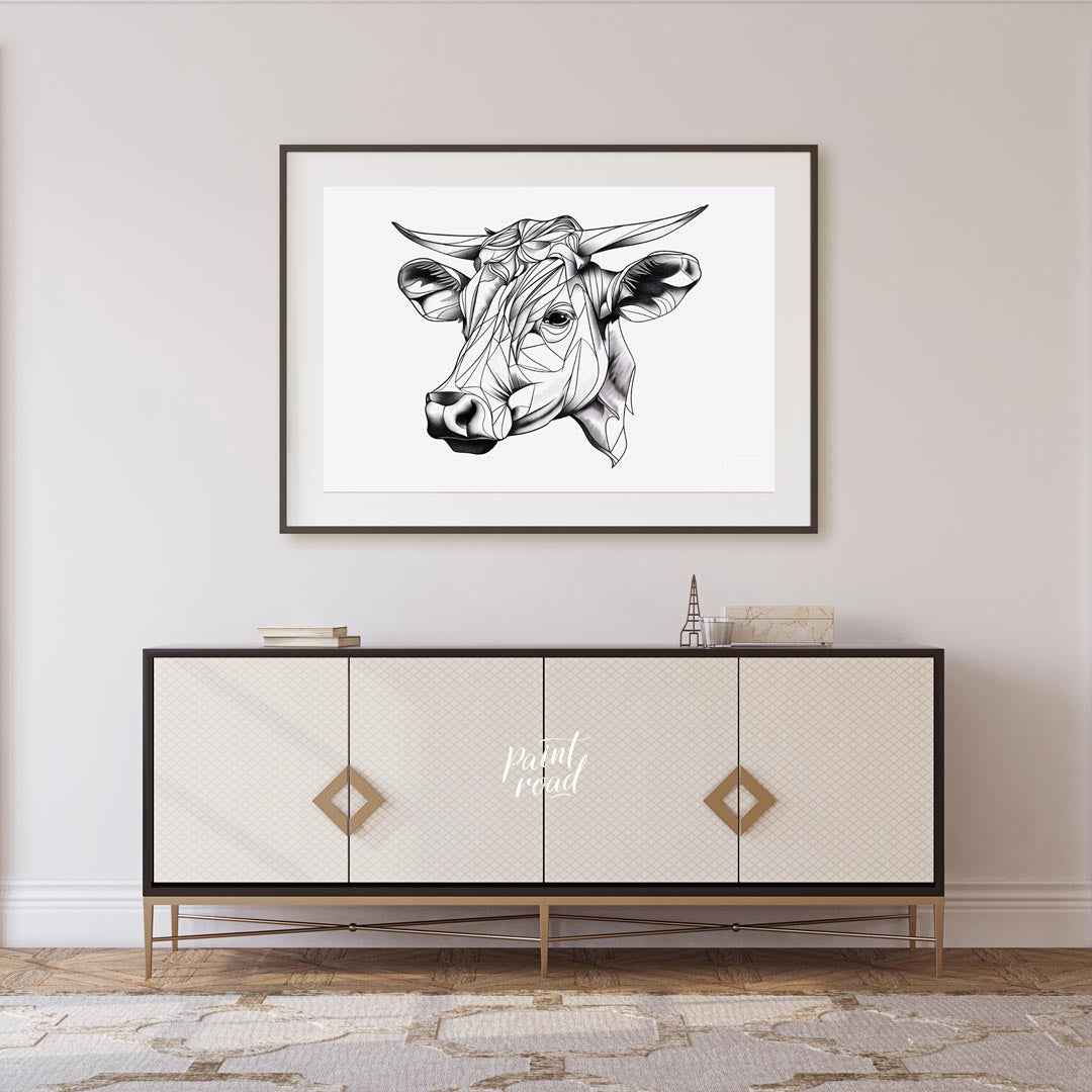 This striking black and white illustration features the head of a cow rendered in a unique geometri… for living room