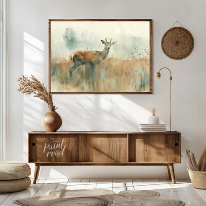 This serene watercolor painting captures a young stag standing gracefully in a field of tall, muted… for living room