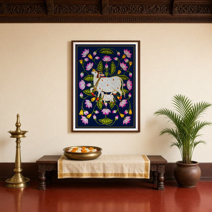 This exquisite Pichwai art piece captures the serene grace of Kamdhenu and her calf amidst a for Entrance