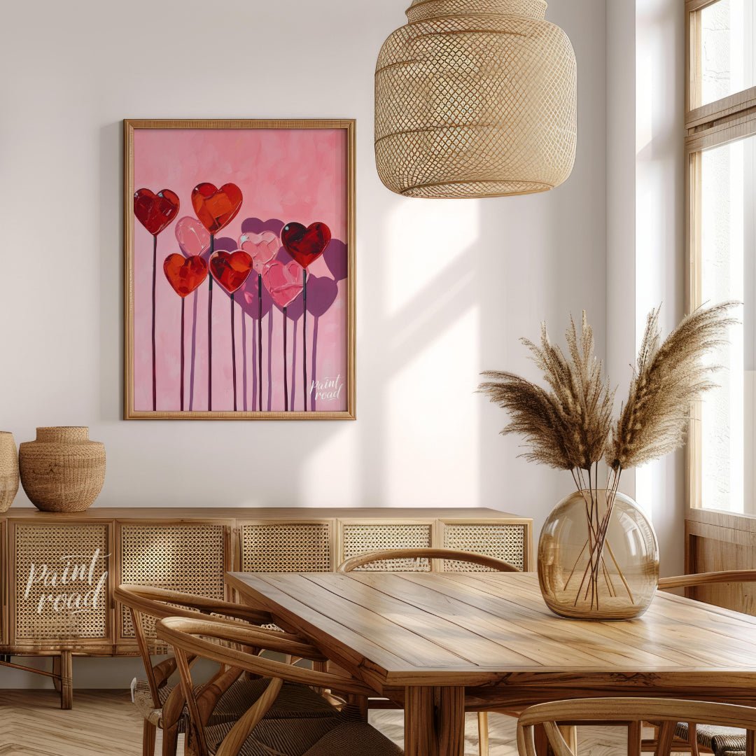 This whimsical artwork features a collection of heart-shaped lollipops against a soft pink backdrop… for dining room