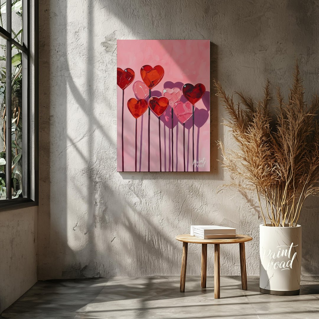 This whimsical artwork features a collection of heart-shaped lollipops against a soft pink backdrop… for living room