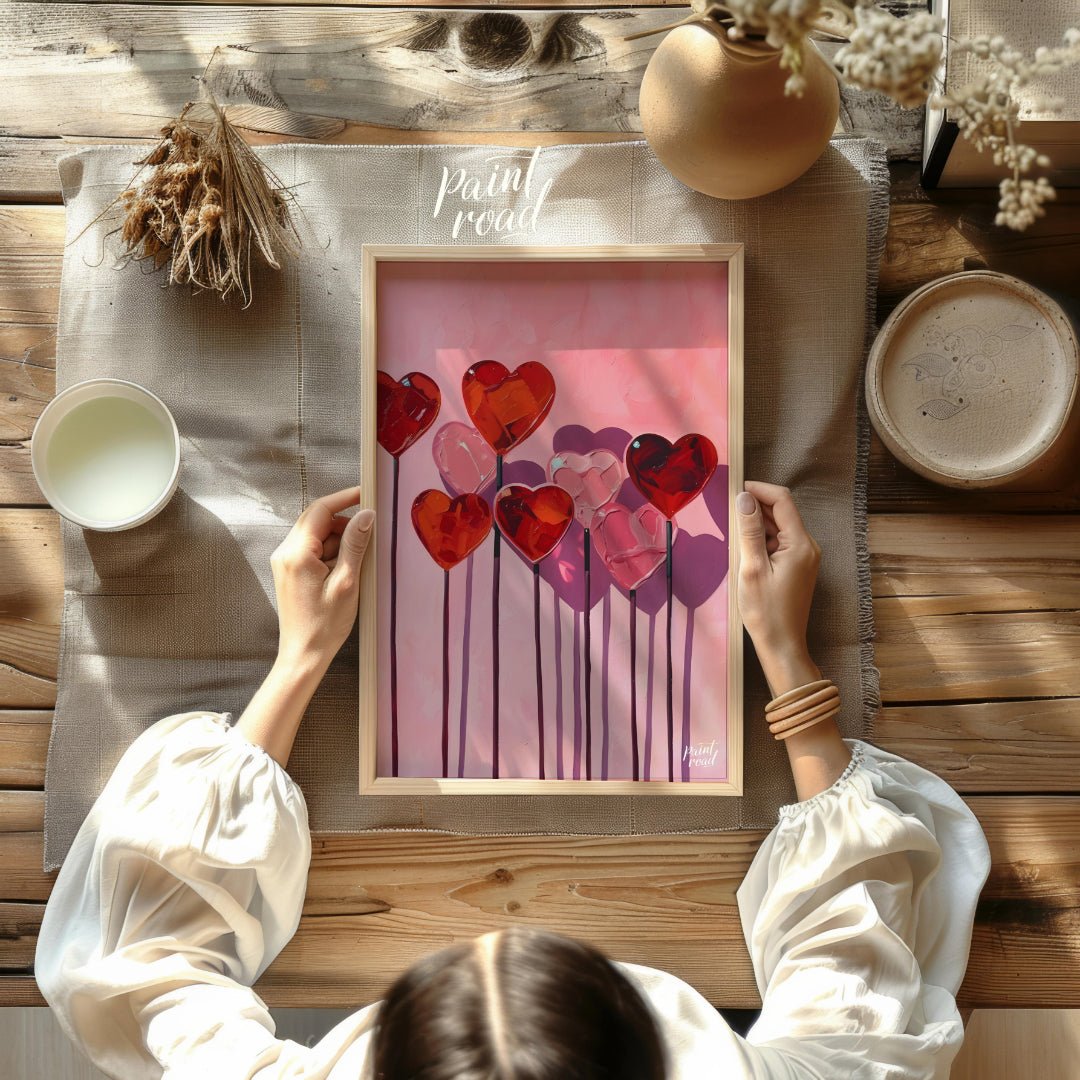 This whimsical artwork features a collection of heart-shaped lollipops against a soft pink backdrop… for other