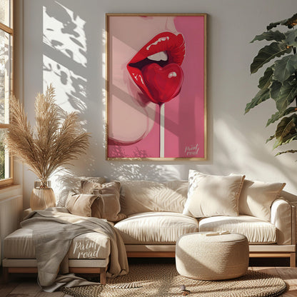 This striking image features a close-up of lips painted in a vibrant red, holding a heart-shaped lo… for living room