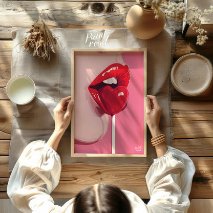 This striking image features a close-up of lips painted in a vibrant red, holding a heart-shaped lo… for other